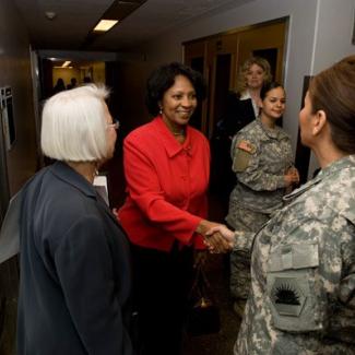 Assemblymember Wilmer Amina Carter meets with members of the California National Guard.