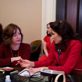 Then-Senator Romero (Vice-Chair of the Legislative Women's Caucus -2010) discusses heart health with a health professional on Go Red for Women day at the State Capitol.