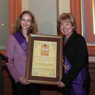 Secretary of State Debra Bowen accepts her award as a “Woman of Distinction” from Senator Jean Fuller with the Legislative Women’s Caucus. 